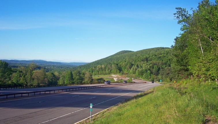 Parkway road near a grassy hill
