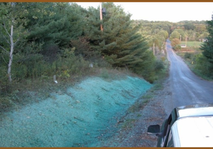Rural road with a shallow gravel ditch alongside