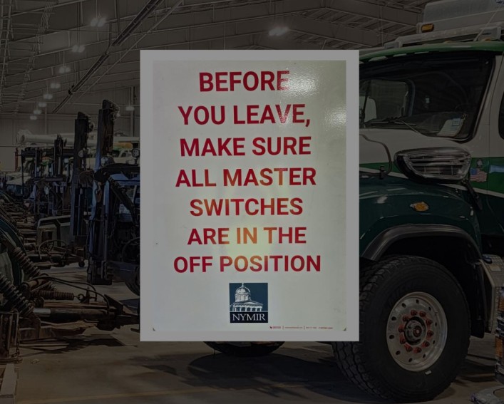 A white sign with red lettering saying "Before you leave, make sure all master switches are in the off position"
